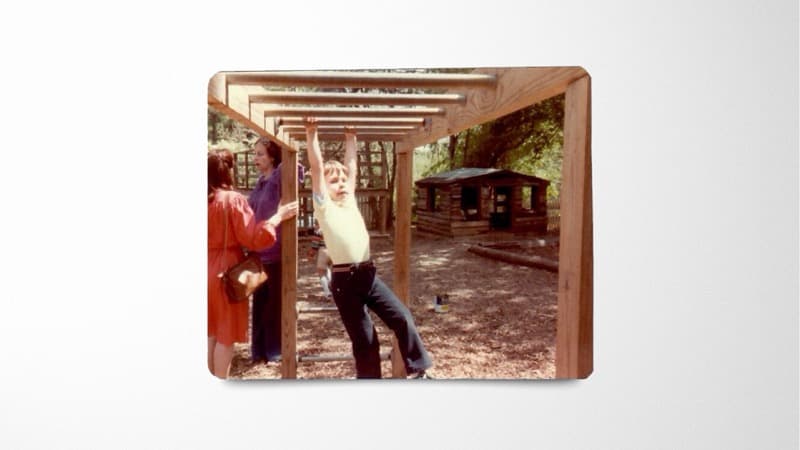 Paul on the monkey bars as a kid