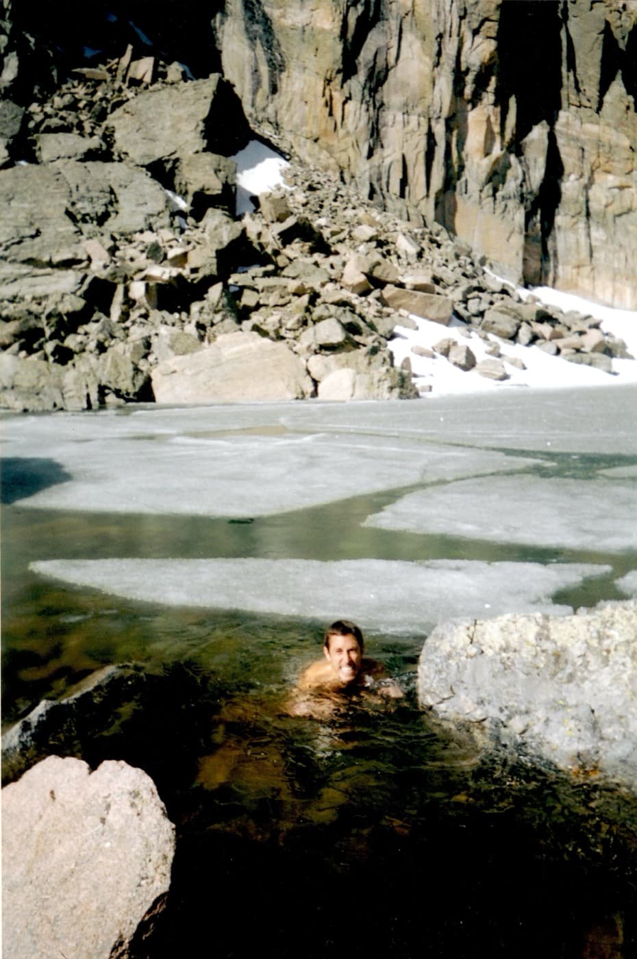 Paul in a snow-ringed alpine lake, early 2000s